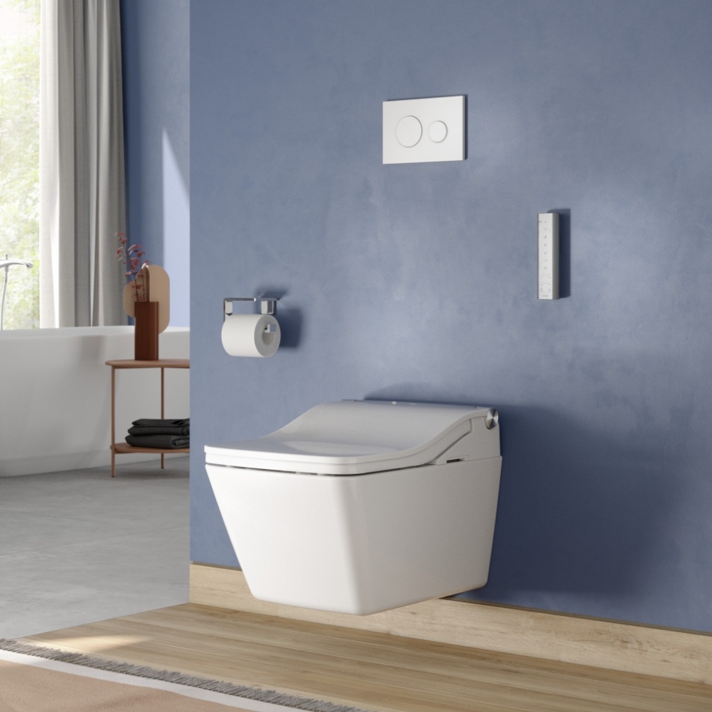 Lifestyle image of the TOTO Washlet SW Rimless Wall Hung Toilet mounted on a blue bathroom wall, surrounded by toilet roll holder and white dual flush plate
